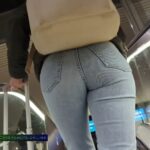 Beautiful bubble ass in jeans waiting for train